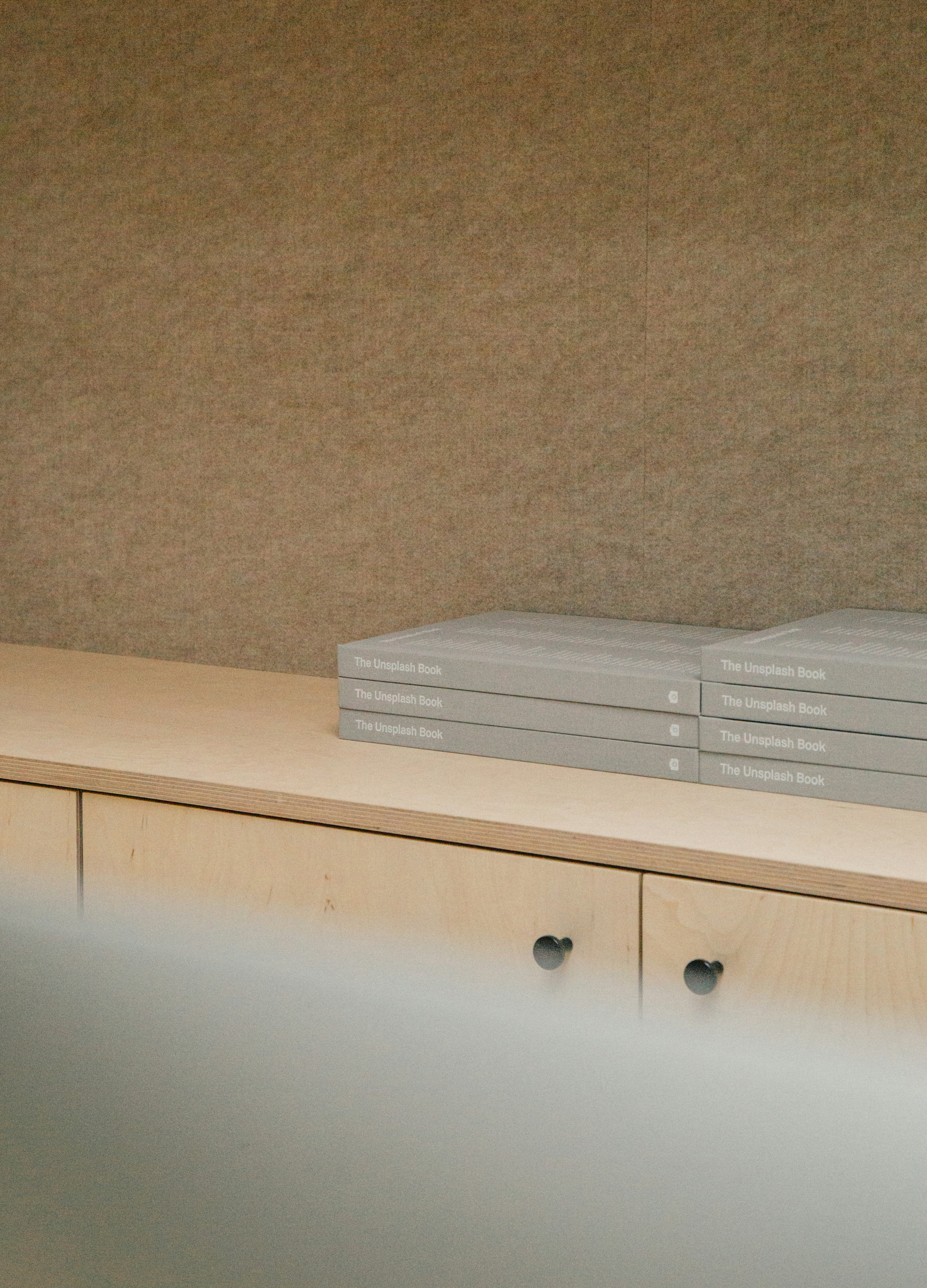 gray boxes on wooden console cabinet